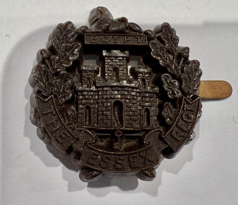 Plastic Economy Badge. The Essex Regiment - chocolate brown.