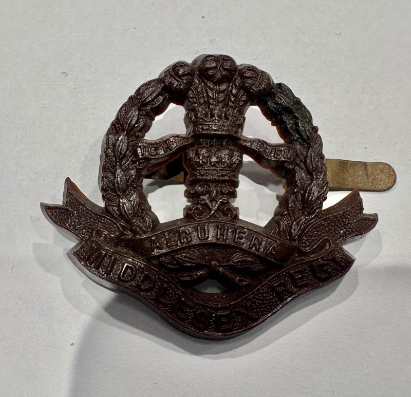 Plastic Economy Cap Badge Middlesex Regiment