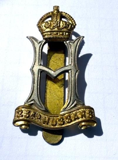 An original World War II King's Crown Officer's cap badge for the 23rd Hussars